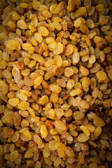Natural sweets, appetizing yellow raisins