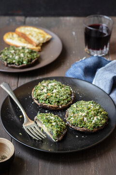 Portobello mushrooms stuffed with bread crumbs, parley and garlic, bread, blach pepper, red wine