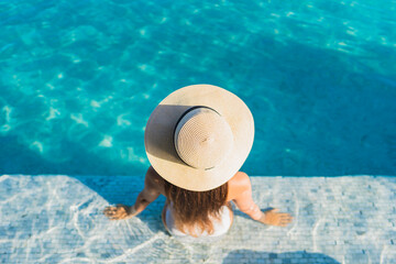 Portrait beautiful young asian woman smile relax leisure around outdoor swimming pool