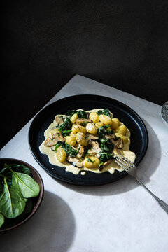 Potato gnocchi with creamy garlic mushrooms suce and spinach