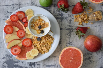 Yogurt with seasonal fruits and granola.