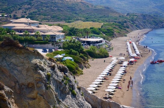 Summer resort, holiday resort Kalamaki on Zakynthos island, Greece. Blue sky, sunny day, Kalamaki beach, turtle beach, sunbeds, umbrellas.