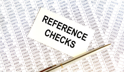 Obraz premium On the business card, the text RATEPAYERS, next to the pen, all on the background of reports.