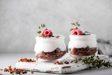 homemade chocolate granola with yoghurt and fresh berries