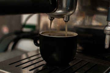 Preparing espresso in a coffee machine.