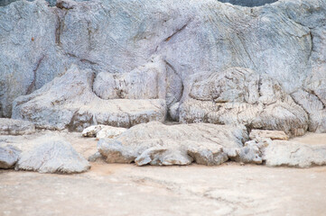 Fototapeta na wymiar A rock that was eroded by water, creating an unusual shape.