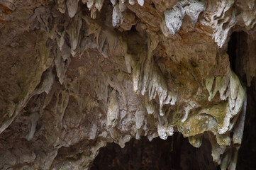The rocks in the front of the cave have various shapes.