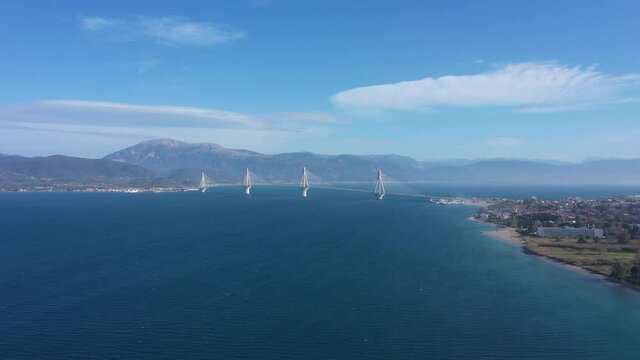 
Drone video. Cable suspension bridge of Rio - Antirio Harilaos Trikoupis. Corinthian Gulf, mainland Greece to Peloponnese, Patras. Ferry crossing. 