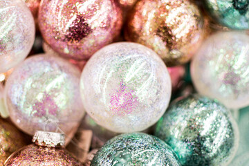 Glass Christmas balls with glitters, sparkles, close up, soft focus