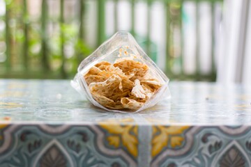 a very tasty and crunchy snack made from very healthy soybeans, known as tempe chips, this is a typical snack from Indonesia