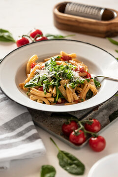 Casarecce with spinach, wild garlic and cherry tomatoes