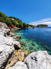 Fototapeta na wymiar Pristine bay view of a Greece Island with concrete steps leading to the water.