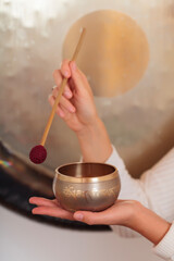 Fototapeta na wymiar Singing bowl, ceremony of welness, sound of tibet