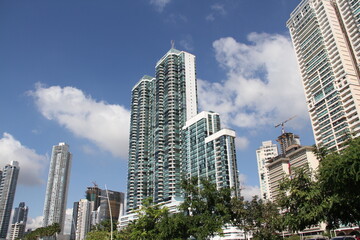 group of skyscrapers with blue sky background with clouds on a summer day