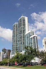 group of skyscrapers with blue sky background with clouds on a summer day
