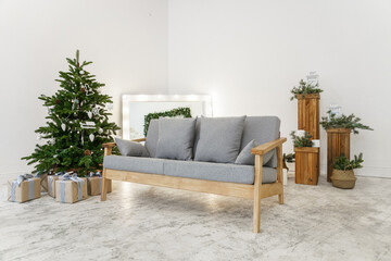 White room with christmas tree and wooden decorations