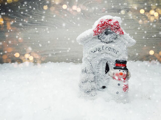 winter background with snowman decor and garland lights
