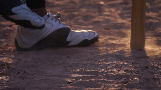 Footage Slow Motin: A close-up softball shoe dealing with the ground