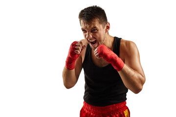 sporty man in red sports bandages throwing powerful punch isolated on white background