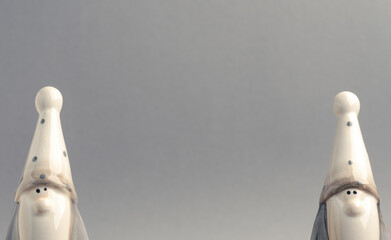 Two funny Santa ona gray background with space for text