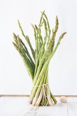 Green asparagus on a white background.