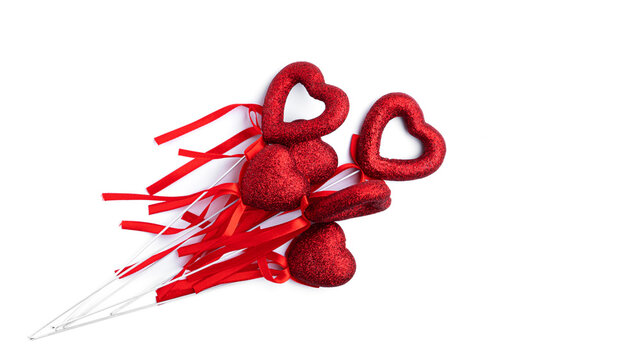 Shiny hearts with a ribbon for valentine's day isolated on white background. High quality photo