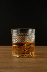 Whiskey glass on a black background