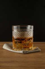 Whiskey glass on a black background