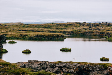 Volcanic rock formations in Lake Myvatn in Northern Iceland in summer