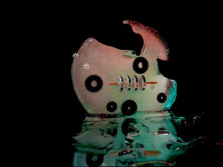 green glowing ice in the dark in which gears and a counter with the number 2021 are frozen