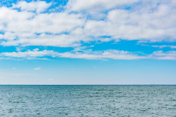 Fototapeta na wymiar Sky over the calm surface of the sea.