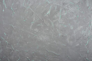 Gray cement wall with green veins background