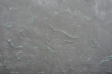 Gray cement wall with green veins background