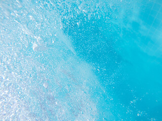 Blue transparent water with many bubbles background