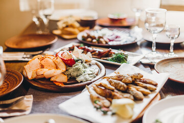 The restaurant table with Ukrainian and European cuisine is served with various delicious dishes for the reception