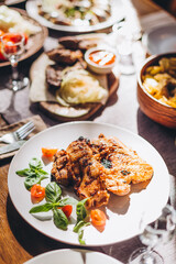 The restaurant table with Ukrainian and European cuisine is served with various delicious dishes for the reception