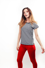 young pretty teenage hipster girl posing emotional happy smiling on white background, lifestyle people concept