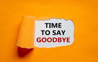 Time to say goodbye. The text 'time to say goodbye' appearing behind torn orange paper. Business concept. Copy space.