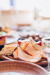 rustic wooden table with many plate of delicious and satisfying meals