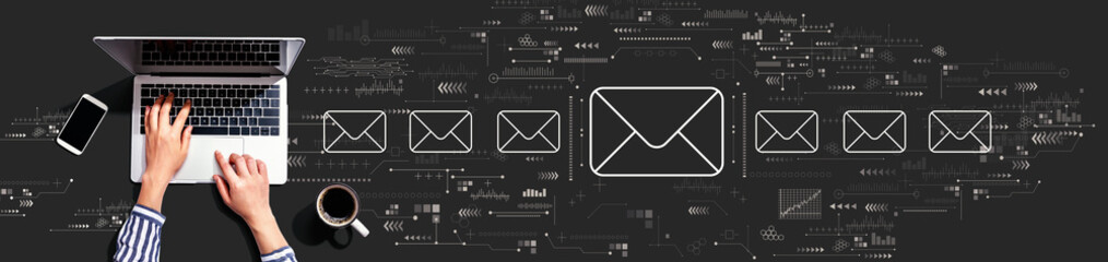 Email concept with person using a laptop computer