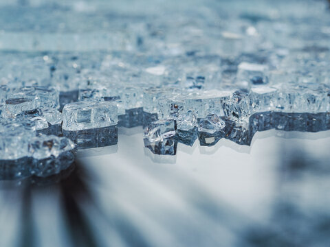 close up of glass crystals on reflecting background