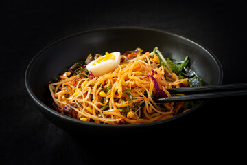 Korean food, JJolmyeon which is mixed with cold chewy noodles with vegetables and spicy sauce