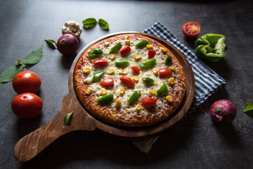 Close up of Italian cuisine pizza along with condiments with use of selective focus.