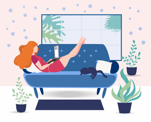 A woman works on a laptop at home on the couch. Freelance concept, quarantine due to covid-19