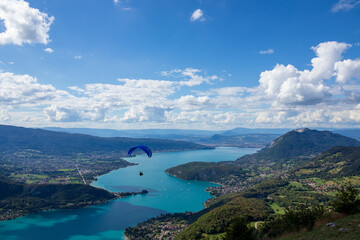Fototapeta na wymiar paraglider over lac d'annecy in france