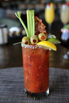 Bloody mary with olives, celery and bacon