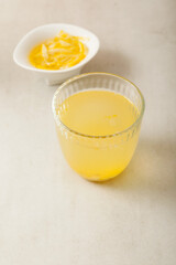 Yujacha (yuja tea or yuzu tea) is a popular Korean tea and Yuja marmalade in bowl. Selective focus, copy space