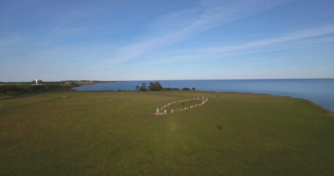Tourists Walking Around Ales Stenar With Social Distance On Top Of The Hill In The Summer Evening In South Sweden Sk&aring;ne &Ouml;sterlen K&aring;seberga, Aerial Forward