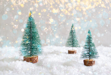 Christmas toy trees on simulated snow. Beautiful festive background for postcards, web, print....