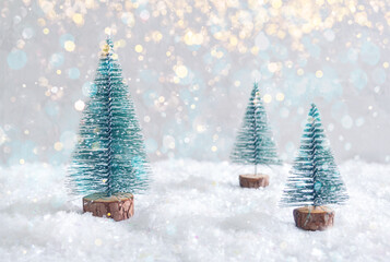 Christmas toy trees on simulated snow. Beautiful festive background for postcards, web, print....